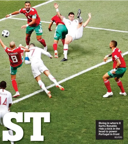  ?? REUTERS ?? Diving in where it hurts: Ronaldo risks a kick in the head to power Portugal in front