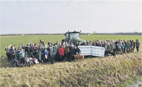  ??  ?? Campaigner­s at the site where the 2,500 homes had been planned