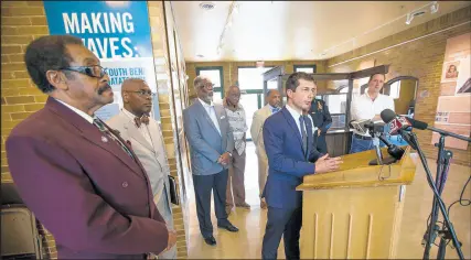  ?? MICHAEL CATERINA/AP PHOTOS ?? Democratic Presidenti­al candidate and South Bend, Indiana Mayor Pete Buttigieg speaks alongside community leaders during a news conference Wednesday at the Civil Rights Heritage Center in South Bend, Indiana.