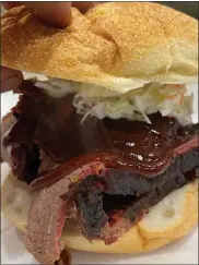  ?? SUBMITTED PHOTO ?? This photo shows a brisket sandwich with slaw that was featured as a special at Spring City’s Curley’s ‘Que, owned by Mark Van Horn.