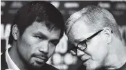  ?? AFP ?? Manny Pacquiao junto al entrenador Freddie Roach.