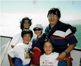  ?? ?? My family’s transition to the US was far from easy, even though my dad worked as an engineer. Here we are two years into our move, on a family vacation in San Francisco in 2003. Photograph: Kai Ngu/Courtesy of the author