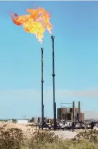  ?? EDDIE MOORE/JOURNAL ?? Natural gas is flared at a well site in the Delaware Basin just south of Carlsbad in September 2019. New Mexico is targeting industry emissions by banning routine flaring and venting, and proposing stricter leak detection standards for industry equipment.