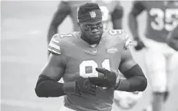 ?? JOHN MCCALL/
SOUTH FLORIDASUN SENTINEL ?? Dolphins defensive end Emmanuel Ogbah walks off the field after losing to the Chiefs on Sunday. The Dolphins’road to the playoffs has become a lot more difficult.