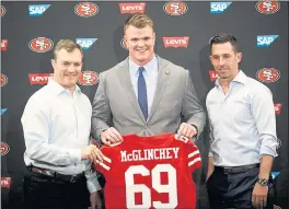  ?? DAI SUGANO — STAFF PHOTOGRAPH­ER ?? New 49ers offensive tackle Mike McGlinchey, center, stands with GM John Lynch, left, and head coach, Kyle Shanahan during a press conference on Friday at Levi’s Stadium.