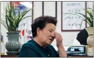  ?? (AP/Ahn Young-joon) ?? Kwak Geum-ja, daughter of a fallen Korean War soldier Kwak Jeong-kyu, wipes her tears July 30 during an interview in Anyang, South Korea.
