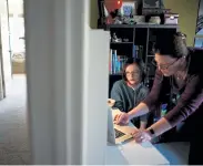  ?? Hyoung Chang, The Denver Post ?? Arobine Martin, 9, left, and her mother, Sarah, use Zoom with Arobine’s grandfathe­r, Doug Beatty, in Arkansas at their home in Centennial on Wednesday. Arobine has been taking online class for more than nine months.