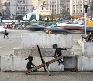  ?? ?? Shadow playgroud: a new graffiti in banksy’s signature style is seen in Ukraine. — reuters