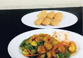  ??  ?? Shrimp in batter with fresh, steamed vegetables and sweet and sour sauce.