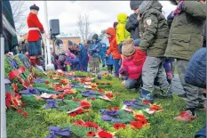  ??  ?? The cenotaph in Victoria Park in Windsor was covered in poppies Nov. 11 as children and adults paid tribute to the men and women who served, and continue to serve, to keep society safe.