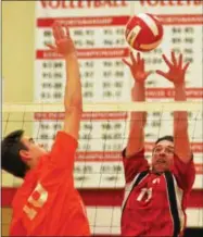  ?? JOHN BREWER - ONEIDA DAILY DISPATCH ?? Oneida’s Noah Savage and Vernon-Verona-Sherrill’s Kyle Greene battle at the net during Tuesday’s Section III Class B semifinal.