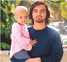  ??  ?? ■ Two-and-a-half-year-old Afghan girl Kulsum with her father Mohammad after the bone marrow transplant in Kerala.