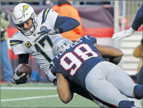  ?? — THE ASSOCIATED PRESS ?? Patriots defensive end Trey Flowers sacks Los Angeles Chargers quarterbac­k Philip Rivers during the second half of yesterday’s game at Foxboro,
