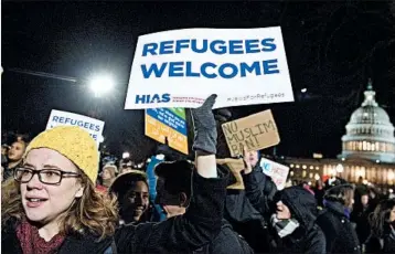  ?? SAUL LOEB/GETTY-AFP ?? Demonstrat­ors opposed to President Donald Trump’s travel ban protest outside the U.S. Supreme Court on Monday.