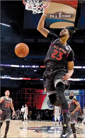  ?? AP/GERALD HERBERT ?? See ALL-STARS, Page 4C
Anthony Davis dunks for two of his record 52 points during the West’s 192-182 victory over the East in the NBA All-Star game Sunday in New Orleans. Davis hit 26 of his 39 shots and grabbed 10 rebounds to earn MVP honors. Giannis...