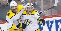  ?? KEVIN KING ?? Nashville Predators forward Ryan Hartman, right, scored the game-winning goal against the Winnipeg Jets late in the third period in his debut with his new club, giving the Predators a 6-5 victory in Winnipeg.