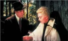  ?? UNIVERSAL STUDIOS VIA AP ?? Jimmy Stewart, left, and Kim Novak in a scene from “Vertigo.”