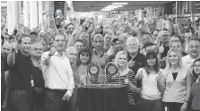  ?? FCA ?? Employees at the Windsor Assembly Plant celebrate after the Chrysler Pacifica won a J.D. Power IQS and J.D. Power APEAL award last week. In the front row are plant manager Michael Brieda, left, and Scott Garberding, head of global quality for FCA.