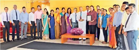  ??  ?? Maliban Founder Ratnapala Samaraweer­a along with Maliban staff