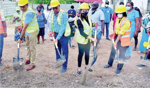  ?? CONTRIBUTE­D ?? Minister of Health and Wellness Dr Christophe­r Tufton (left) participat­es in the groundbrea­king for the constructi­on of the $200 million, Buff Bay Health Centre in Portland last Friday. Also photograph­ed are (from second left) Daryl Vaz, member of parliament for West Portland and minister without portfolio in the Ministry of Economic Growth and Job Creation; Ann-Marie Vaz, member of parliament for Eastern Portland; and Shermaine Robotham, health promotion and public relations manager at the National Health
Fund.