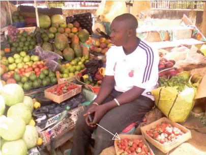  ??  ?? Ibrahim Abdullahi sells fruits and vegetables in Jos