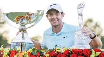  ?? Picture: USA TODAY Sports ?? THE BEST. Ulsterman Rory McIlroy celebrates with the FedEx Cup and the Tour Championsh­ip trophy after winning the season-ending tournament in a play-off at East Lake Golf Club on Sunday.