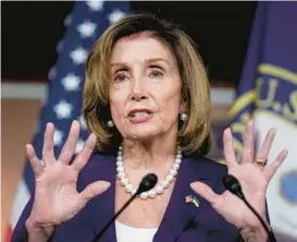  ?? J. SCOTT APPLEWHITE/AP ?? House Speaker Nancy Pelosi updates the media Friday as Democrats push ahead to bring a bill banning assault weapons for a vote. The House bill passed 217-213.