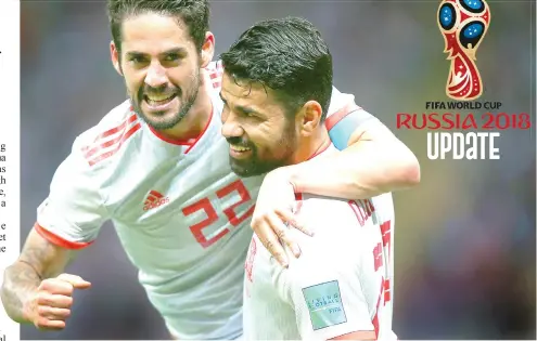  ?? AGENCE FRANCE PRESSE ?? Spain’s forward Diego Costa (R) celebrates his goal with midfielder Isco during the Russia 2018 World Cup Group B football match between Iran and Spain at the Kazan Arena in Kazan.