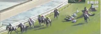  ?? ?? In this image made from a video, horses and jockeys hit the ground in an accident during the Hong Kong Sprint at Sha Tin Race Course, Hong Kong, Dec. 12, 2021.