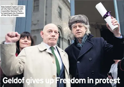  ??  ?? Bob Geldof (right) arrives at City Hall in Dublin with Councillor Mannix Flynn to hand back his Freedom of the City of Dublin