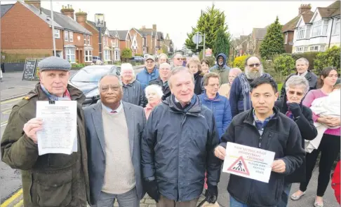  ?? Picture: Gary Browne FM4215818 ?? John Goodman, Cllr George Koowaree, Jed Stacey and postmaster Ashay Rai with residents on the Hythe Road