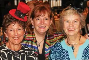  ??  ?? Former Bryn Mawr resident Susan Jordan, Alice Hughes of Media and Elaine Davey of Flowertown await the pre-lunch fashion show.