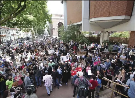  ??  ?? Protesters gather outside Kensington town hall in west London, the headquarte­rs of the Royal Borough of Kensington and Chelsea, demanding answers over the Grenfell Tower fire disaster Friday. AP PHOTO