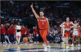  ?? RYAN SUN — THE ASSOCIATED PRESS ?? Clemson guard Chase Hunter celebrates after a win over Arizona in a Sweet 16game in the NCAA tournament on Thursday in Los Angeles.