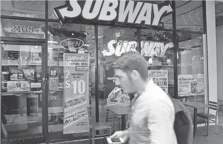  ?? JOE RAEDLE/GETTY IMAGES ?? Five-dollar footlongs are back on the menu at Subway.