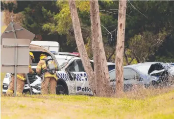  ?? Picture: ALISON WYND ?? MOWED DOWN: Emergency workers at the scene of the accident in Mt Duneed on November 20 in which Sergeant Anthony French was injured.