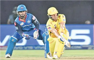  ?? — AFP photo ?? Chennai Super Kings' Shane Watson(R) on his way to a half-century on Friday.