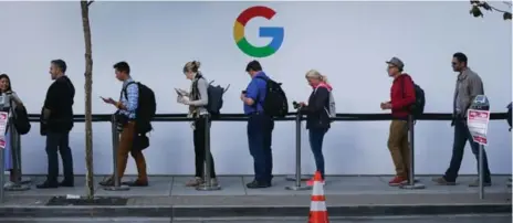  ?? ELIJAH NOUVELAGE/AFP/GETTY IMAGES ?? Attendees wait in line to enter a Google product launch event on Wednesday at the SFJAZZ Center in San Francisco.