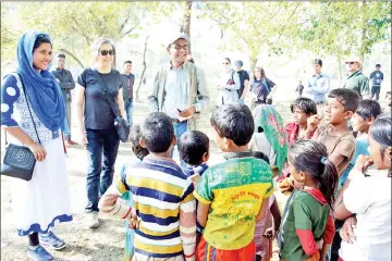  ??  ?? Yanghee Lee (second left), the United Nation’s Special Rapporteur on the situation of human rights in Myanmar, visits a Rohingya camp in Bangladesh’s Cox’s Bazar. — AFP photo