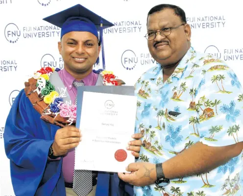  ?? Photo: Vilimoni Vaganalau ?? Sanjay Raj celebrates with Navesh Bharat (uncle) after graduating with an Executive Masters in Business Administra­tion at the Vodafone Arena on December 13, 2017.