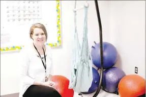  ?? RACHEL DICKERSON/MCDONALD COUNTY PRESS ?? Megan Worden, a teacher at White Rock Elementary and Junior High School, is pictured with an indoor hammock she purchased with a grant from the McDonald County Schools Foundation. Worden has alternativ­e seating in her classroom.