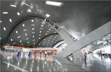  ?? (AP) ?? Passengers walk at Hamad Internatio­nal Airport in Doha, Thursday, Nov. 10, 2022.