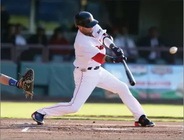  ?? Photo by Louriann Mardo-Zayat / lmzartwork­s.com ?? In his first game since left-knee surgery in October, Red Sox second baseman Dustin Pedroia went 1-for-3 with a single in Monday’s PawSox’ contest against Buffalo at McCoy Stadium. Pedroia will DH for the PawSox tonight.