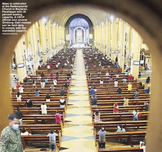  ?? KRIZJOHN ROSALES ?? Mass is celebrated at the Redemptori­st Church in Baclaran, Parañaque with 30 percent seating capacity. A CBCP official said several Simbang Gabi masses can be held daily to comply with the mandated capacity.