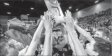  ?? Arkansas Democrat-Gazette/MITCHELL PE MASILUN ?? Baptist Prep celebrates after winning the boys Class 4A state championsh­ip Saturday at Bank of the Ozarks Arena in Hot Springs. It was the sixth state title for the Eagles.