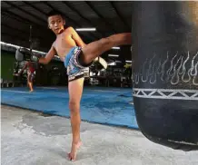  ?? — AP ?? Starting young: 10-year-old Chaichana Saengngern training at a kickboxing camp in Bangkok.