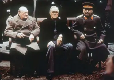  ?? FILE — THE ASSOCIATED PRESS ?? This is a file photo of from left, British Prime Minister Winston Churchill, U.S. President Franklin Roosevelt and Soviet Premier Josef Stalin as they sit on the patio of Livadia Palace, Yalta, Crimea. Initially hailed as a major success, the...