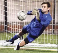  ?? Arnold Gold / Hearst Connecticu­t Media ?? Guilford goalie Justin Hess blocks a penalty shot in the second half of the SCC Championsh­ip in Madison against Hand in 2020.