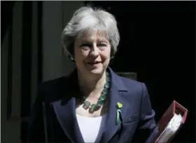  ?? KIRSTY WIGGLESWOR­TH — THE ASSOCIATED PRESS FILE ?? Britain’s Prime Minister Theresa May leaves 10 Downing Street to attend the weekly session of PMQs at parliament in London. The British government is facing another knifeedge vote in Parliament on Wednesday over how much control lawmakers should have...