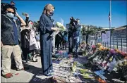  ?? IMAGES VIA USA TODAY] ?? Speaker of the House Nancy Pelosi arrives to pay her respects at the makeshift memorial for Supreme Court Justice Ruth Bader Ginsburg in front of the Supreme Court on Saturday in Washington. [SAMUEL CORUM/GETTY